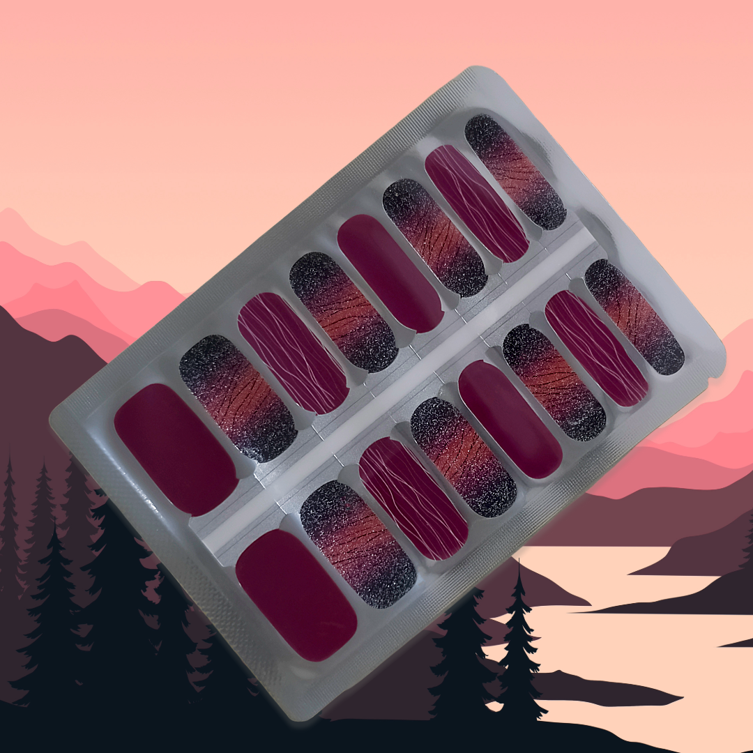 Midnight Ember nailwraps with berry, sunset ombré, and black glitter for a wild, nature-inspired manicure.