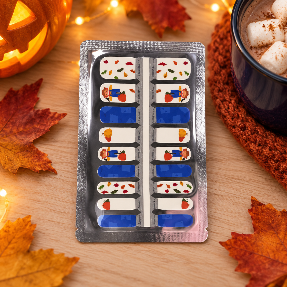 Kids Blue Scarecrow nail wraps styled with a cosy cup of cocoa