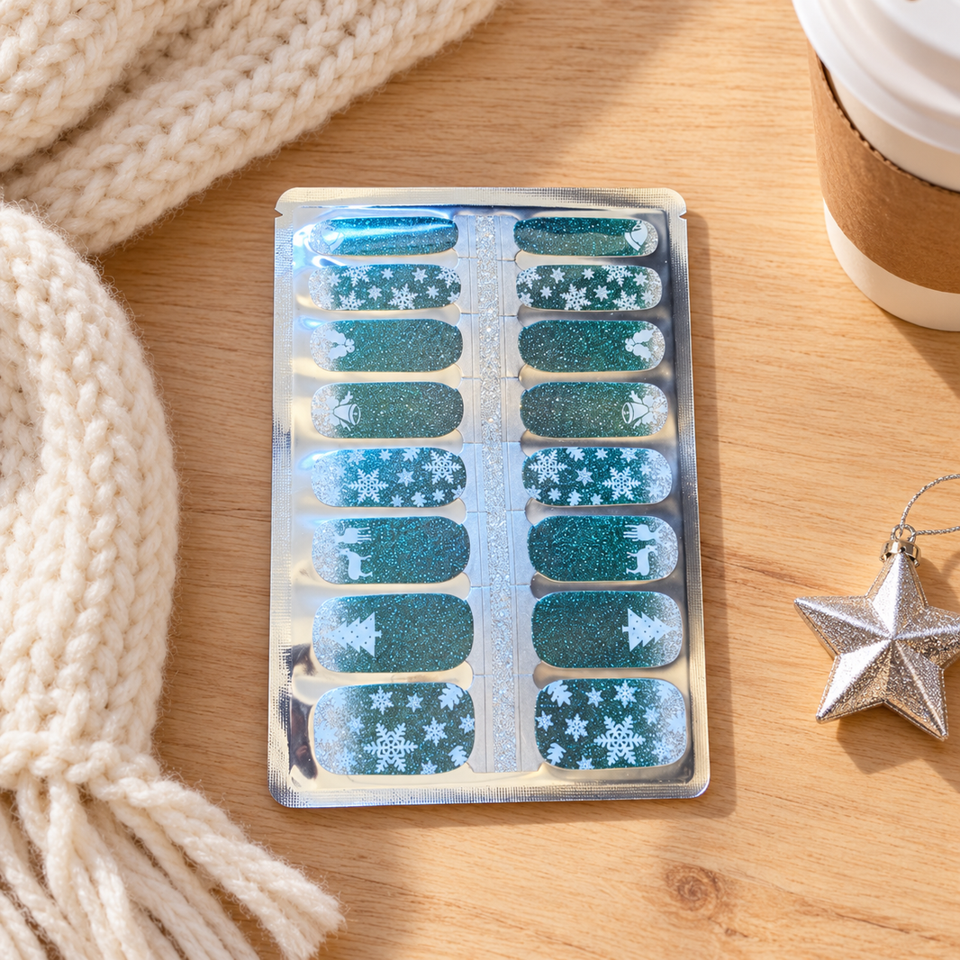 Twinkling Snowfall Christmas Nail Wraps, glittery teal with snowflakes, trees and reindeer – EZYNails nail wraps, NZ