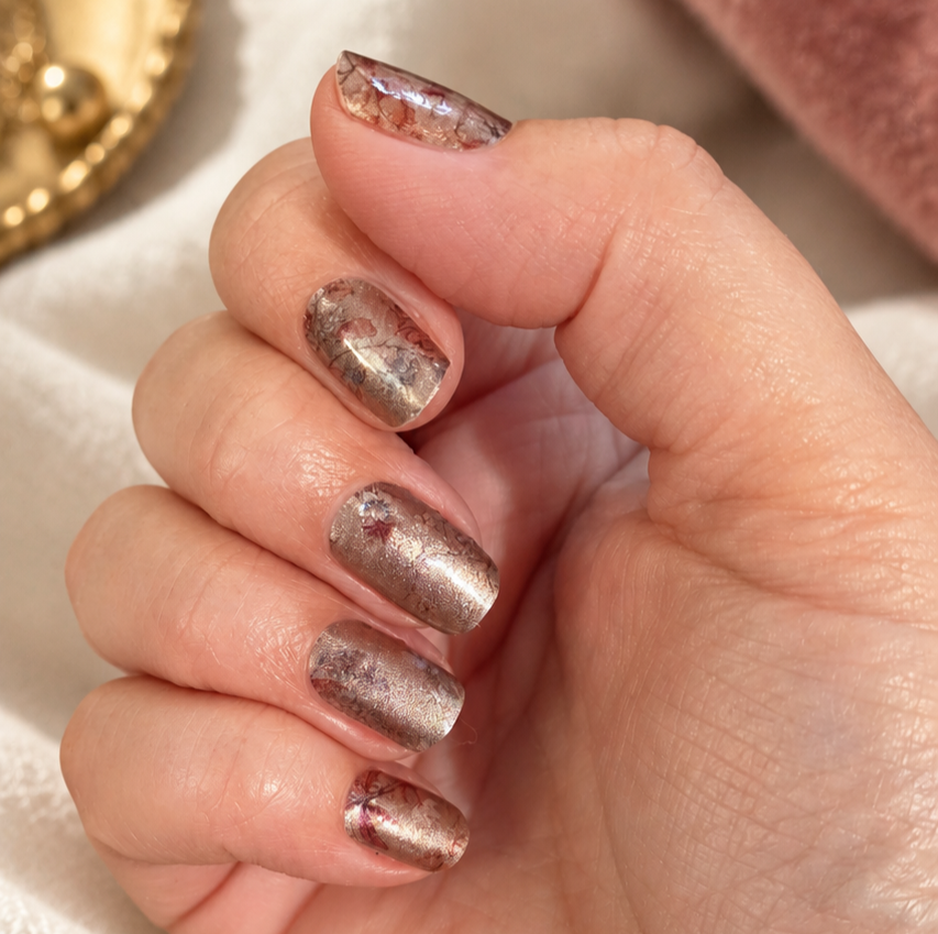 Nude floral nail wraps worn on nails, nailfie close-up